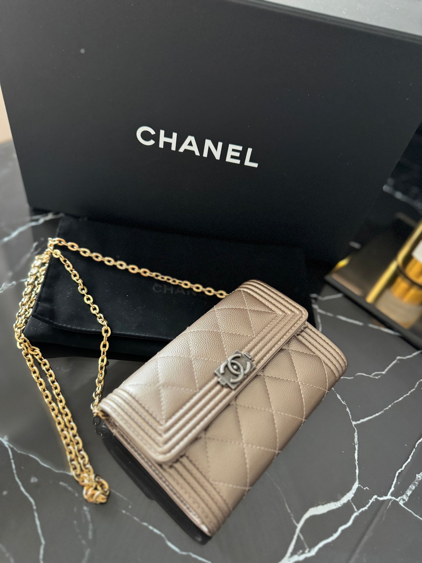 Never worn!! 
Chanel boy leather wallet (chain adaptable)
